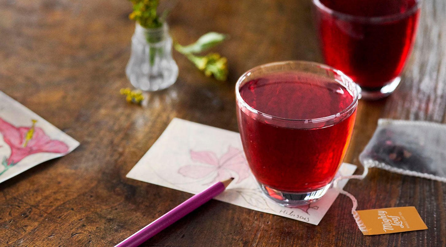 A glass of ruby red Mighty Leaf hibiscus tea