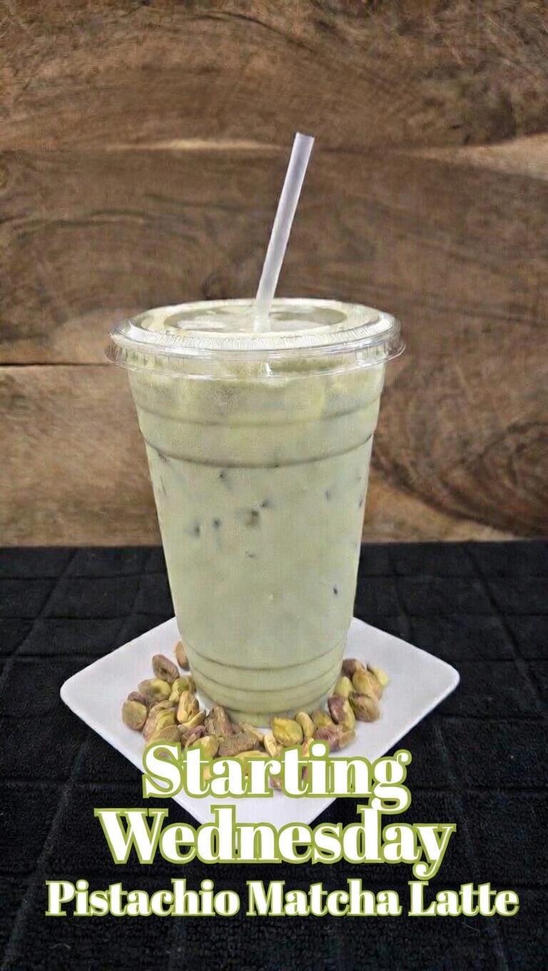 An iced pistachio matcha latte with pistachios
