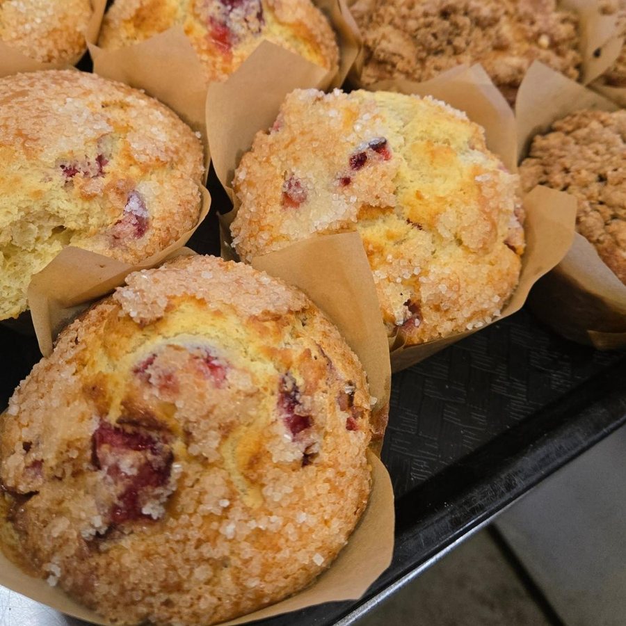 Berry muffins and crumb muffins in the case